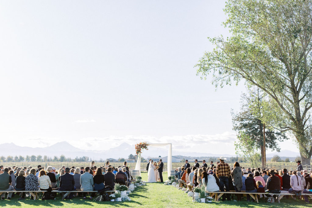 Ceremony with a mountain top background Bend, Oregon Private Ranch Estate Wedding