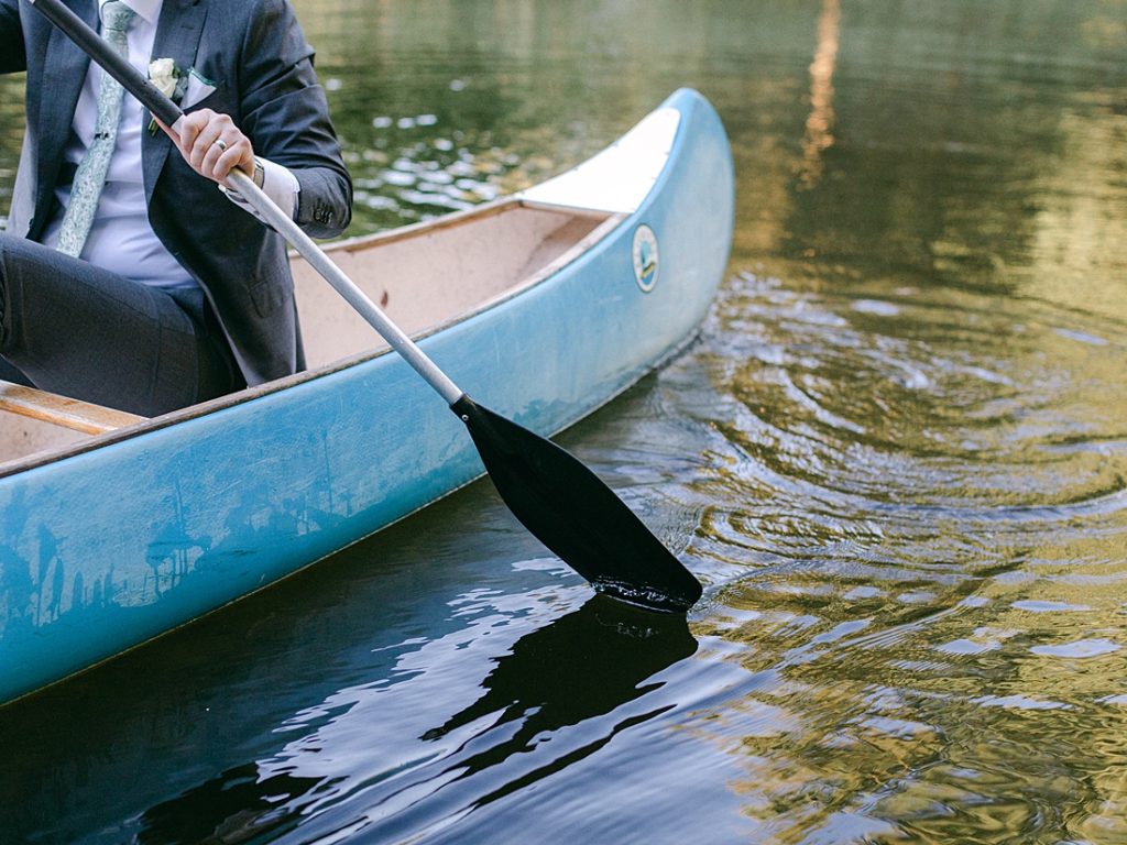 Bride and groom in canoe