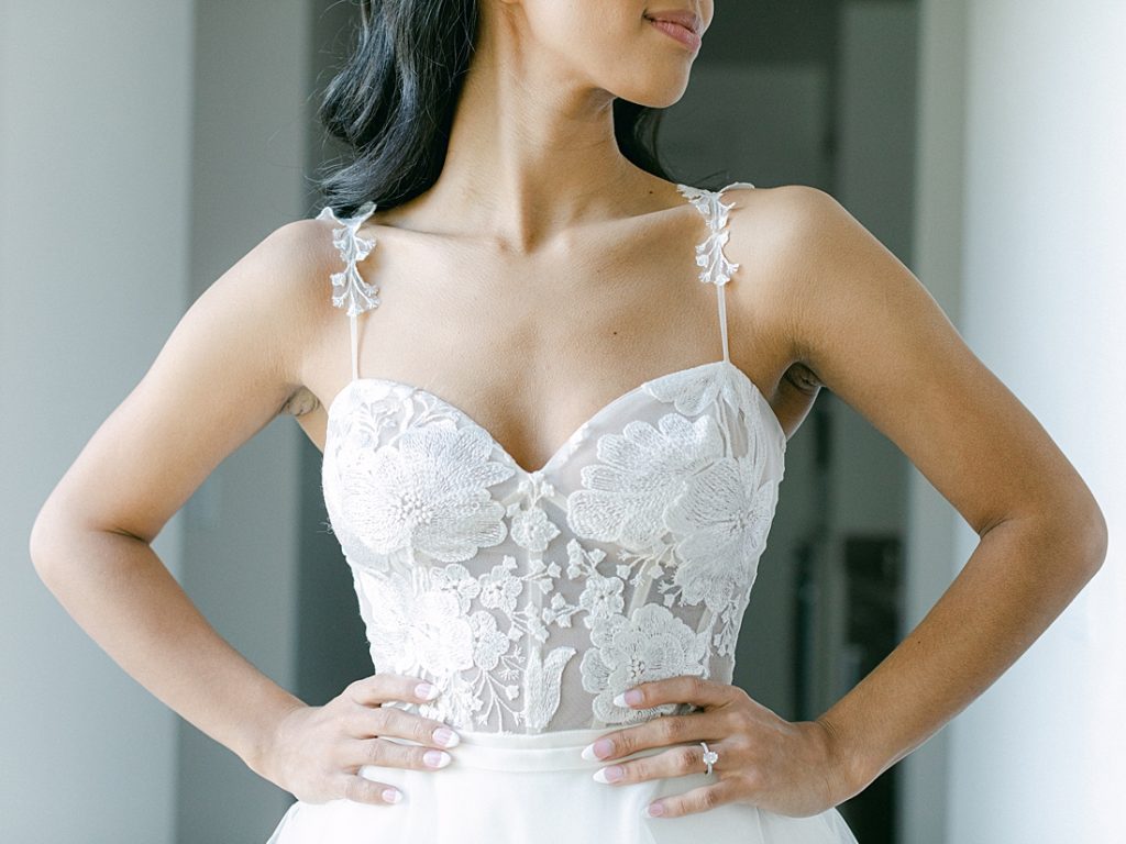 Chic and modern wedding - bride in dress with hands on hips