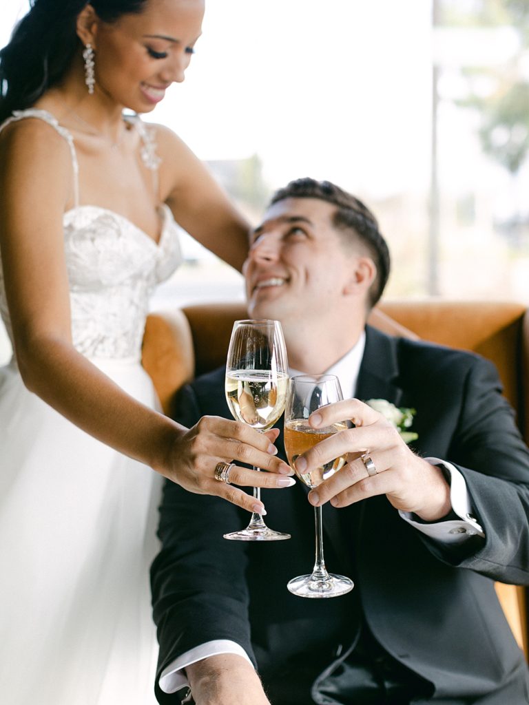 Bride and groom toast with champagne glasses