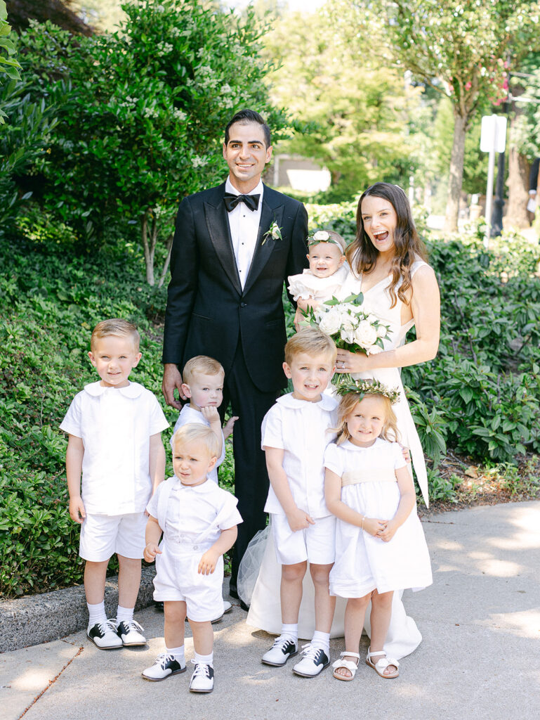 A bride and groom with their wedding party at their organ wedding