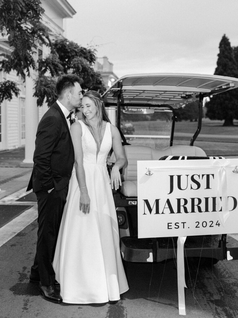  couple with golf cart at Waverley country club wedding 