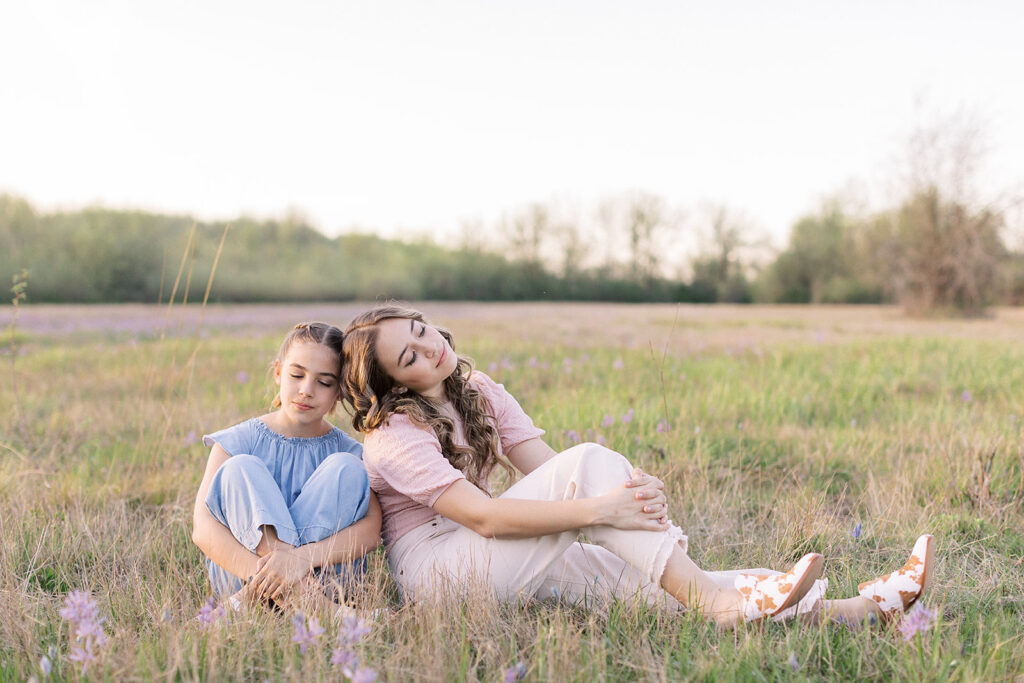 Family wearing coordinating outfits at the park during a spring photo session