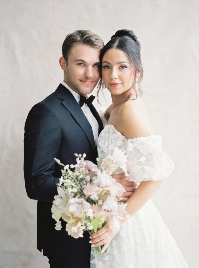 Romantic bridal style featuring a floral appliqué gown, soft bouquet by Seventh Stem, and styling by KC Experiential House — perfect inspiration for Oregon brides planning a 2025 wedding.