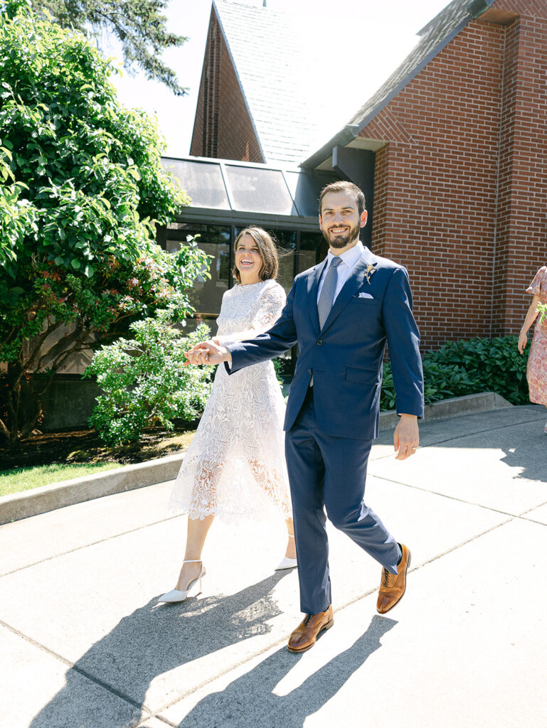 Bride and groom exiting church after wedding ceremony Lake Oswego