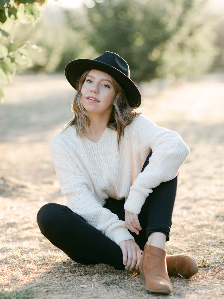 High school senior portrait in open fields at Dorris Ranch