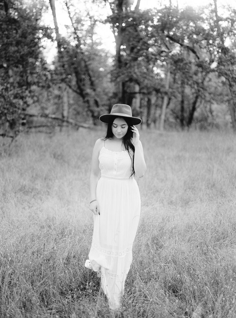 Outdoor senior portrait in open meadow at Mount Pisgah