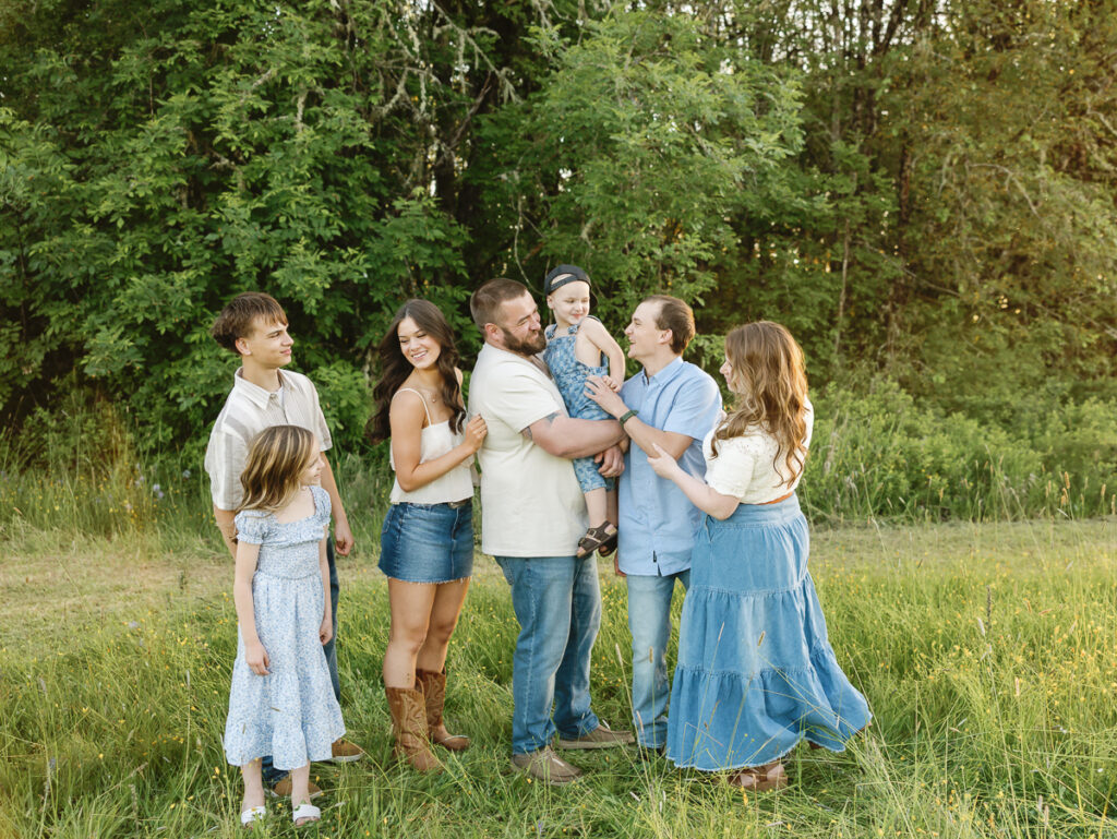 Family photo session in Eugene Oregon featuring candid moments at sunset