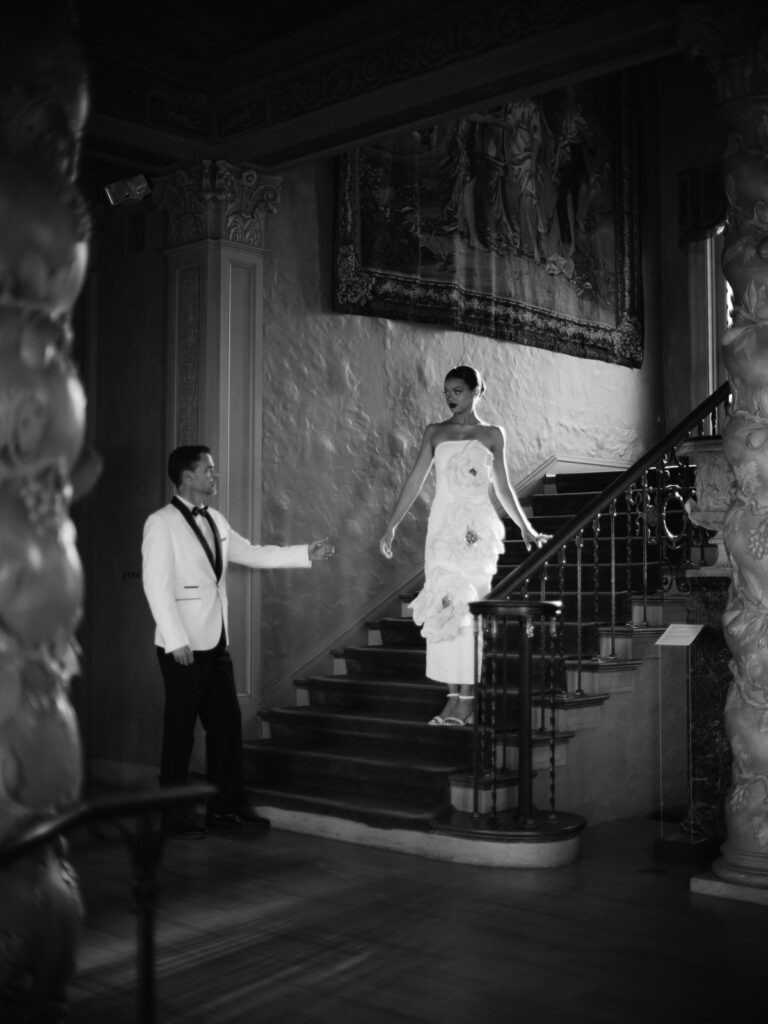 Editorial wedding portrait with historic architecture backdrop
