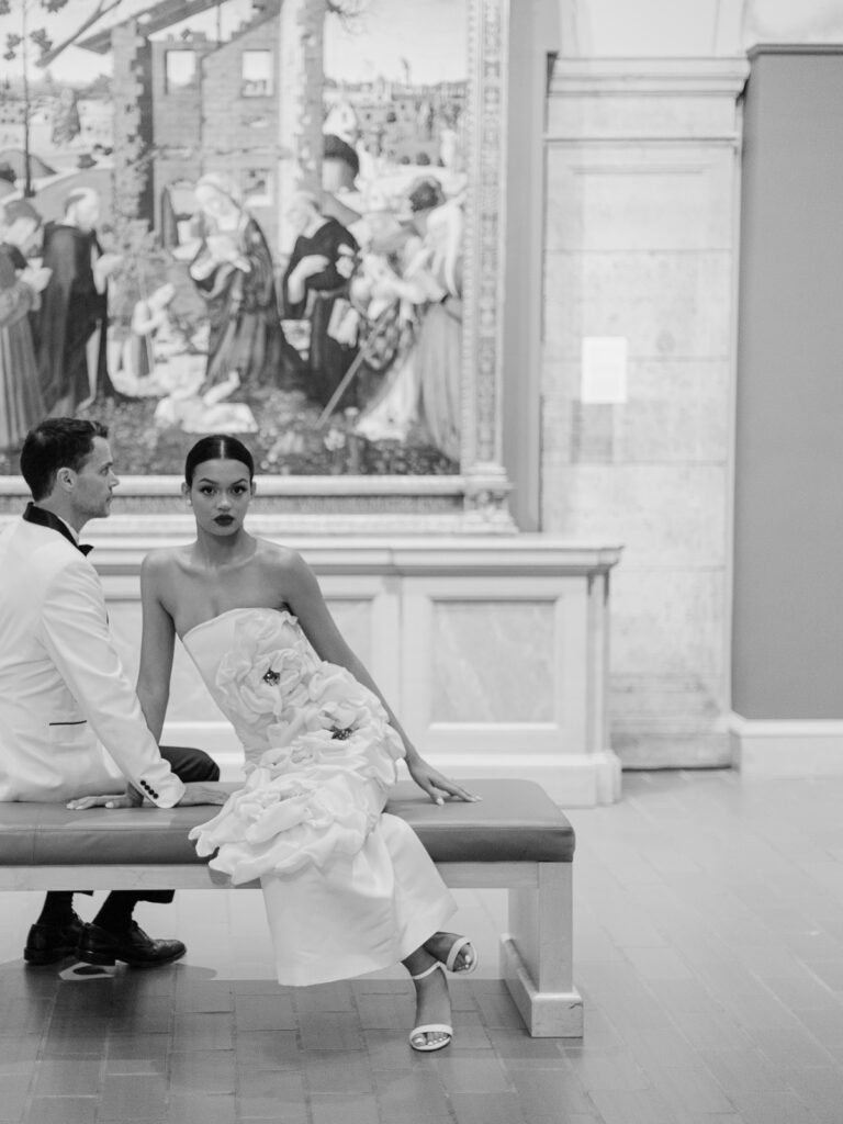 Editorial wedding portrait with historic architecture backdrop