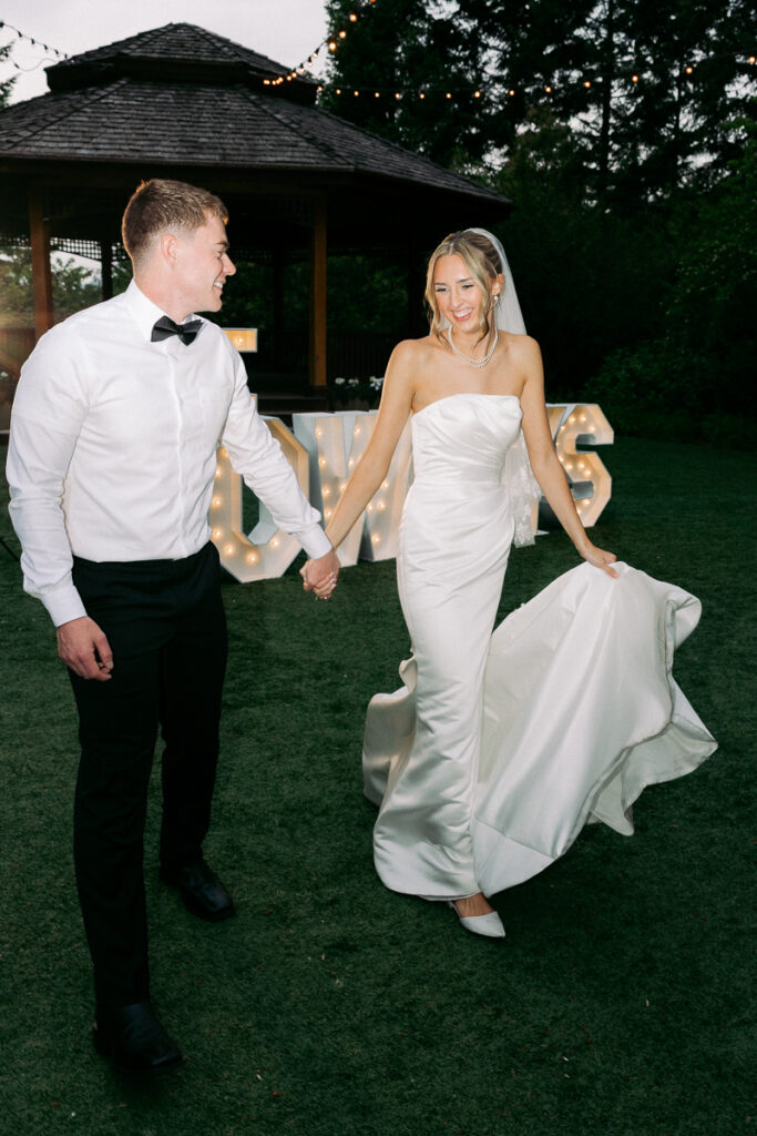 portrait of Owen and Emily in classic wedding attire at an oregon reception