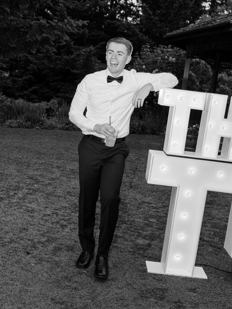 Black and white portrait of Owen and Emily in classic wedding attire at an oregon reception